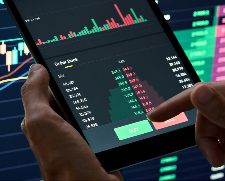 A person using a trading app on their tablet